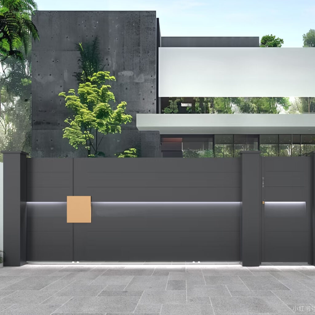 Modern dark grey aluminum sliding driveway gate with integrated LED lighting strip.