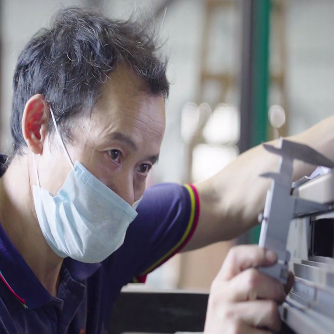 About Kingston Technician performing quality checks on aluminum profiles at our Aluminum Pivot Door Factory.