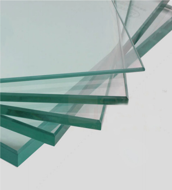 Stack of clear single tempered glass sheets with polished edges for interior doors.