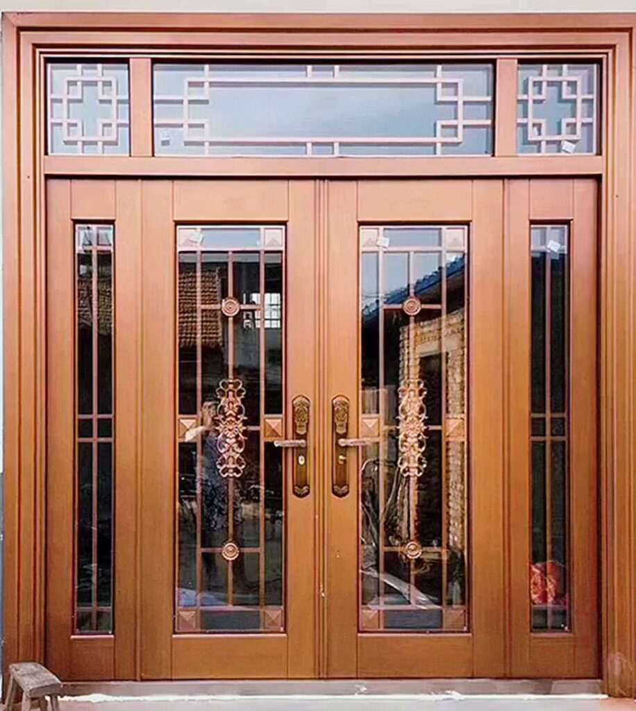 Custom-made copper front door with vertical glass strips and luxury metallic bronze finish.