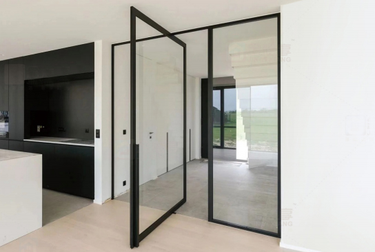 Minimalist Interior Glass Pivot Door with black aluminum frame, functioning as a modern room divider.