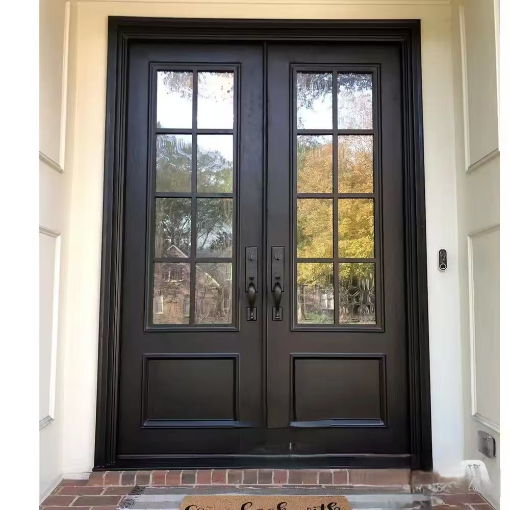 A large modern pivot entry door featuring a natural wood finish and a full-length black vertical pull handle, designed by a leading custom door manufacturer.